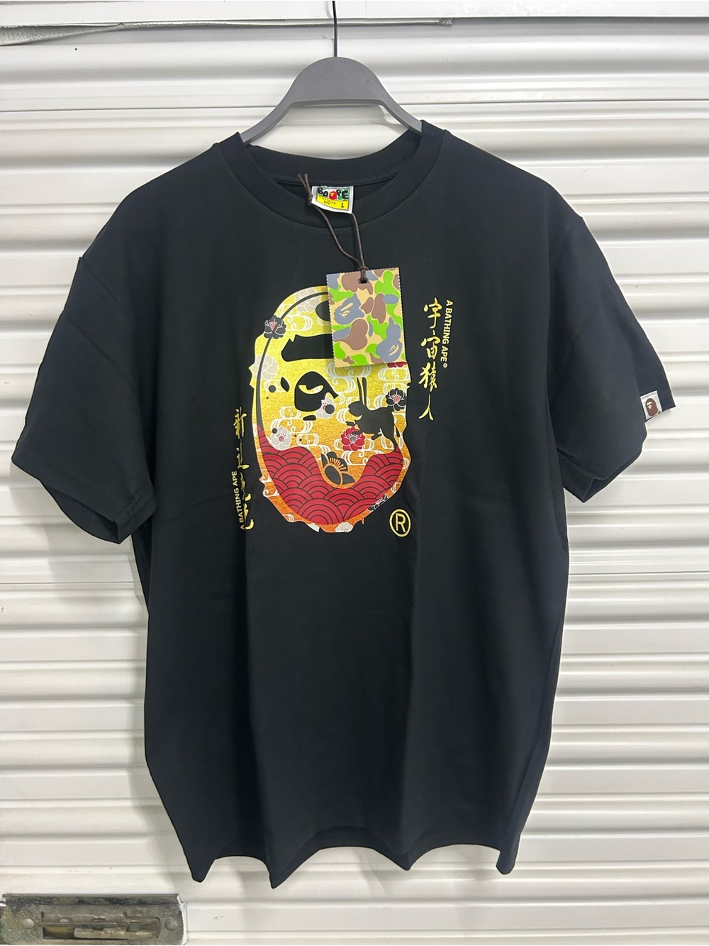 Black Short-Sleeve Graphic Tee with Yellow & Red Mask Illustration